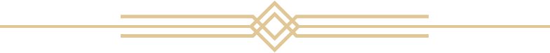 An ornamental gold divider on a black background.